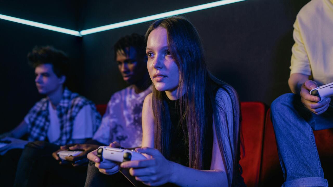 Group of friends focused on multiplayer gameplay