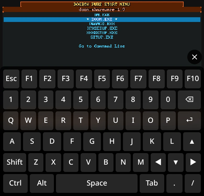 Rebit's PC keyboard overlay with function keys, letters, arrows, and modifiers below the DOS program list